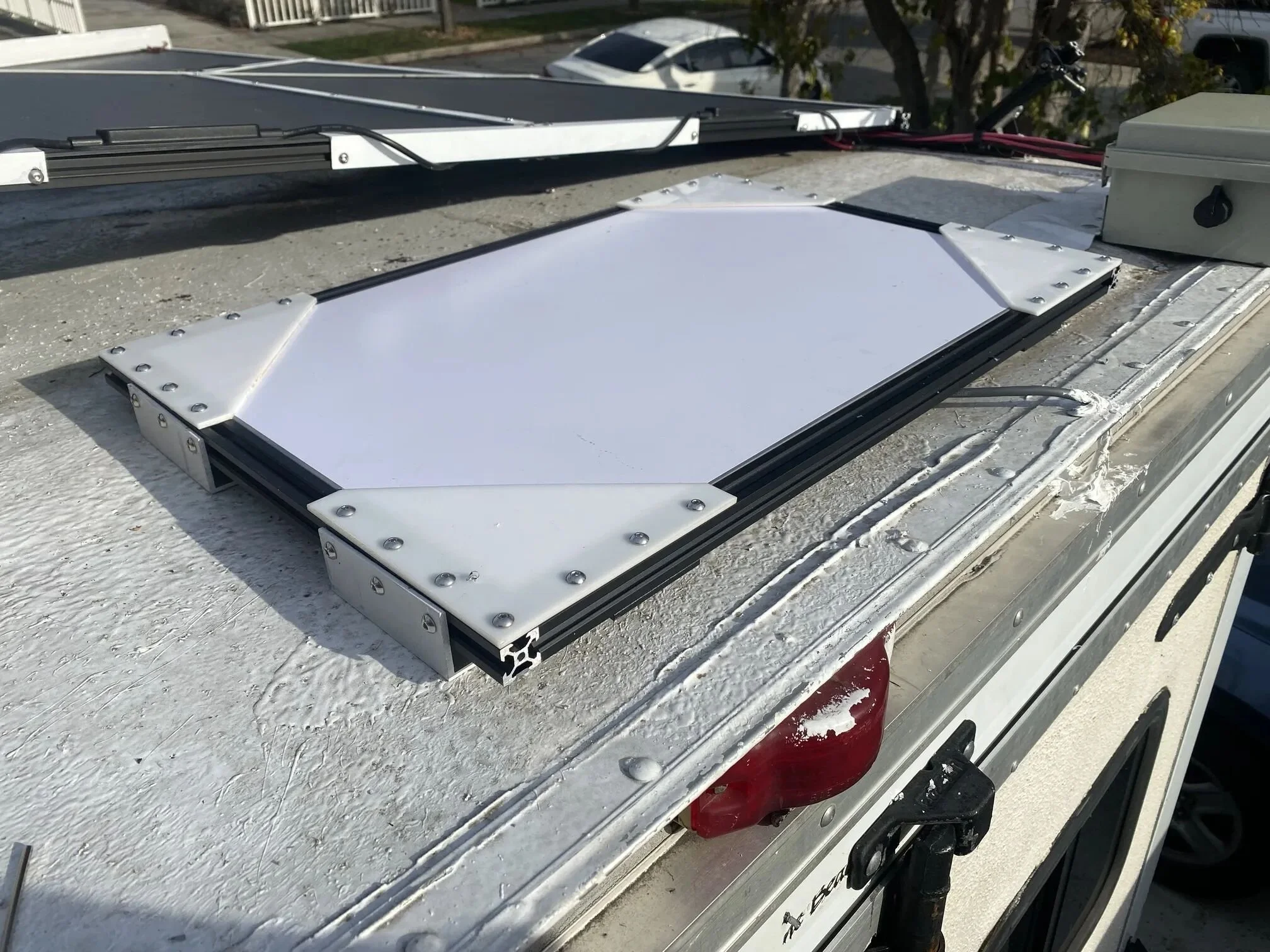 Ended up scraping it once Gen3 came out.  The field-of-view upgrade really improved flat-mount use. It's already-flatness also let me quickly whip up a 2020 extrusion and laser-cut Delrin mount. I was at least able to reuse the aluminum roof-mount brackets.