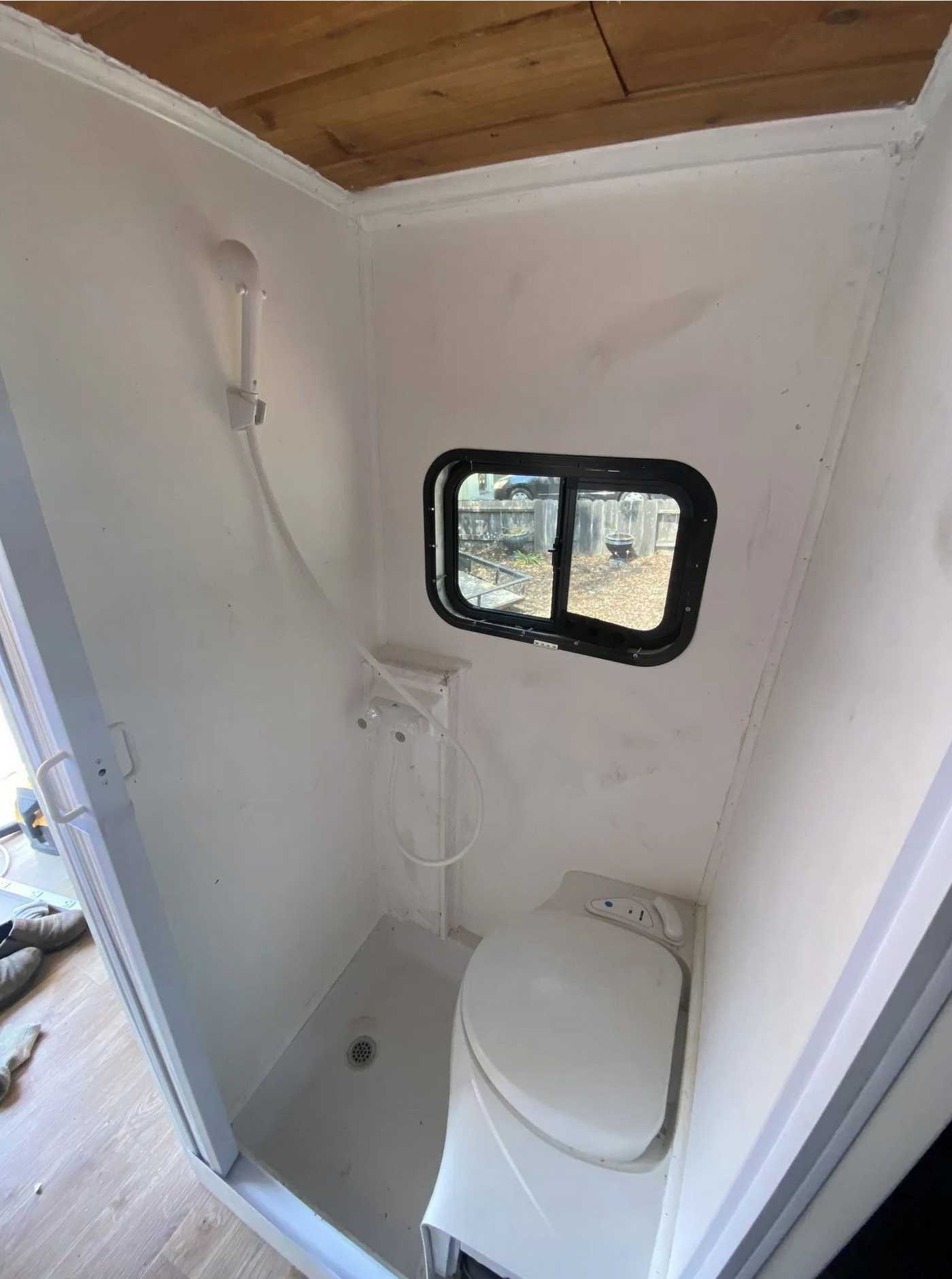 Hot-water shower and flushing toilet